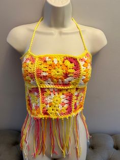 Crocheted bohemian top. One size fits most. Bohemian Crochet Top For Summer Music Festival, Sleeveless Fringe Top For Beach Season, Bohemian Crochet Top For Music Festival, Bohemian Summer Halter Top, Bohemian Halter Top For Summer, Fitted Bohemian Halter Top, Bohemian Crochet Top With Fringe For Festivals, Bohemian Crochet Fringe Top For Festival, Yellow Bohemian Crochet Top For Festival