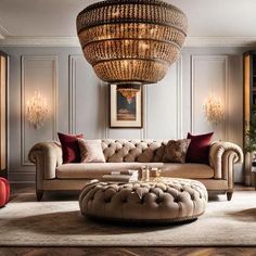 a living room filled with furniture and a chandelier hanging over the top of it