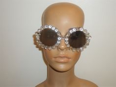 This listing is for a pair of unused really nice Betsy Johnson sunglasses.  These sunglasses are designed with a really cool clear trim and have mirrored lenses.  They have 100% UV Protection. No scratches. Guaranteed to be in excellent unused condition. Perfect for spring/summer.  Make this a great gift or treat yourself!! Vintage Silver Sunglasses For Party, Party Sunglasses With Clear Mirrored Lenses, Party Clear Sunglasses With Mirrored Lenses, Party Clear Mirrored Sunglasses, Clear Sunglasses With Uv Protection For Parties, Party Sunglasses With Anti-reflective Glass, Kew Gardens, Betsy Johnson, Vintage Brown