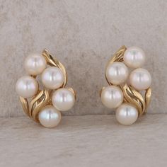 This ladies 14k yellow gold earrings have ten round Akoya pearls that measure 5.5-6mm in size. The earrings measure 21.3 mm in height and 14.6 mm in length. These earrings are clip on and weigh 7.9 grams, including the pearls. Condition: Pre-Owned *All items are thoroughly inspected for quality assurance purposes Flower Earrings Gold, Akoya Pearl Earrings, Yellow Gold Earrings, Akoya Pearls, Yellow Gold Earring, Cluster Earrings, Quality Assurance, Flower Earrings, Earrings Gold