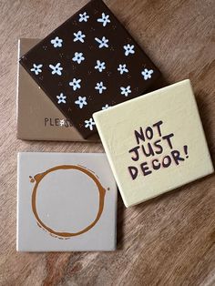 three coasters that say not just decor