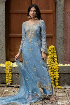 Blue kurta with thread embroidered floral vine motifs, embellished by beads, cutwork and scalloped border. Comes with palazzo and scallop border dupatta. - Aza Fashions Wedding Kurta With Resham Embroidery And V-neck, Festive V-neck Kurta With Intricate Embroidery, Wedding V-neck Kurta With Resham Embroidery, Unstitched Blue Tissue Silk Kurta, Blue Raw Silk Kurta With Sheer Dupatta, Blue Kurta With Sheer Dupatta In Raw Silk, Elegant V-neck Salwar Kameez With Zari Work, Elegant Blue Tissue Silk Kurta, Blue Tissue Silk Salwar Kameez With Zari Work