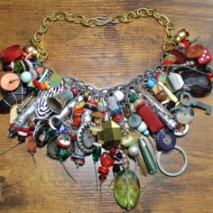 Make a statement with this one-of-a-kind assemblage.  Artfully assembled with antique buttons, handmade beads, game pieces and various jewelry findings along with upcycled pieces from a creative life.  A work of art to be worn by someone with an artistic spirit! Junk Necklaces, Upcycled Jewelry Diy Statement Necklaces, Things To Make With Old Jewelry, Upcycled Jewelry Diy, Junk Necklace, Upcycle Toys, Treasure Necklace, Assemblage Art Collage, Handmade Steampunk Metal Necklace