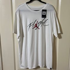 Jordan Flight T-Shirt Size Xxl Nwt White Graphic Tee With Crew Neck, White Casual Pre-shrunk T-shirt, Casual White Pre-shrunk T-shirt, White Cotton Sports Shirt, White Graphic Tee For Sports, White Sporty Crew Neck Shirt, Sporty White Crew Neck Shirt, Sporty White Print Short Sleeve Top, White Graphic Print Sports Shirt