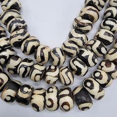 Batik Bone Beads, African Beads - Etsy Bohemian Round Spacer Beads, White Beaded Bracelet With Oval Large Beads, White Beaded Bracelets With Large Oval Beads, White Artisan Beaded Necklaces With Oval Beads, Artisan White Beaded Bracelets With Wooden Beads, Bohemian Spacer Beads For Crafting, White Spacer Beads For Crafting, Bohemian Beads For Jewelry Making, Unique Polished Beads For Beach