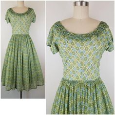 Lovely green fit and flare dress from the late 40s I think (from the zipper).  It has cute gathering around the neck line.  Skirt is fully gathered at waist.  Dress goes over the head and closes with a 11 inch 'Talon' brand green metal zipper on the side.  The bodice is fully lined, but the skirt is not and the fabric is semi sheer so it may require a petticoat underneath (last photo I tried to show my hand thru the fabric.  Photographed with white crinoline underneath).  Nice construction of th 1950s Style Green A-line Dress, Green Retro Vintage Dress, Green Vintage Dress With Ruffles For Garden Party, Green Ruffled Vintage Dress, 1950s Green Short-sleeved Dress, Green Vintage Dress With Ruffles, 1950s Style Green Short Sleeve Dress, 1950s Green Short Sleeve Dress, 1950s Style Green Vintage Dress For Spring