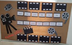 a bulletin board with film reels and clapsticks