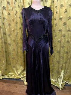 Very detailed purple silk dress in good condition  Size -  Waist 28 inches  Length of skirt - 40 inches  Sleeve - 22.5 inch Full Length Silk Dress With Bias Cut, Silk Full-length Bias Cut Dress, Full Length Silk Bias Cut Dress, Purple Silk Bias Cut Dress, Silk Bias Cut Full-length Dress, Purple Party Dress With Bias Cut, Purple Bias Cut Dress For Party, Purple Bias Cut Party Dress, Purple Long Sleeve Dinner Dress