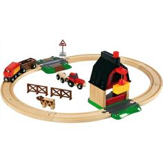 a wooden toy train set with cars and farm animals