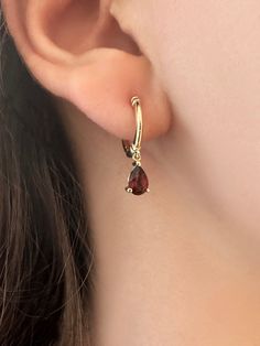 These hoop earrings make magic happen. A timeless design with a modern twist, the red garnet stone hoops will add sophistication to any outfit.  These earrings have been carefully handcrafted  14K yellow gold, and have one beautiful pear cut garnet that has been attached to the gorgeous hoops.  Choose white gold, yellow gold, or rose gold. Each piece is custom made   for you! These earrings come as a pair. ✦ Earrings Details: -      Total Earring Length Charm and Hoop- 0.78 Inc'' / 20 mm - Gold Earrings With Red Stone, Fine Jewelry Teardrop Gemstone Hoop Earrings, Fine Jewelry Red Hoop Earrings, Teardrop Gemstone Hoop Earrings In Fine Jewelry Style, Red Gemstone Hoop Earrings, Red Hoop Fine Jewelry, Classic Gemstone Huggie Earrings For Gift, Classic Gemstone Hoop Earrings Gift, Fine Jewelry Teardrop Hoop Earrings As Gift