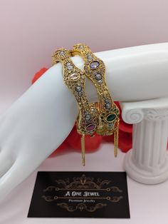 Indian bollywood fashion stunning 2pcs bridal wedding 22K gold plated kundan, polki bangles set size 2.6  These are high quality gold plated bangles set. Have done gold plating on it for a brilient shine. These looks great when you worn alone or in pair. They are sure to make your hands look beautiful. A popular combo to wear with many outfits. A perfect gift for your loved ones or yourself.  A perfect ornament for wedding, parties or any special event.  Stone Colour: Multi Main Colour: Gold Pro Gold Plated Bracelets For Diwali Wedding, Gold Plated Bracelets For Wedding And Diwali, Gold Plated Wedding Bracelets For Diwali, Bollywood Style Gold Bridal Sets Hand Set, Elegant Gold Bangle With Latkans, Bollywood Jeweled Wedding Bracelets, Bollywood Style Jeweled Wedding Bracelets, Gold Jeweled Bangle For Diwali, Gold Bracelets With Latkans For Wedding