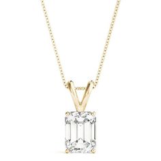 a necklace with an emerald cut stone in the center on a gold plated chain