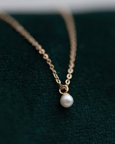 This Mini Pearl Pendant Necklace is the perfect complement for your evening wear or casual wardrobe. Crafted from 14k gold, this delicate necklace features a small cultured pearl, lending it a minimalist and elegant look. With this classic and versatile accessory, you're sure to make a statement. Pearl size: 2.75-3mm 1 Classic Pearl Necklace With Delicate Chain, Classic 14k Gold Pearl Necklace With Round Pendant, Classic Akoya Pearl Necklace With Delicate Chain, Minimalist Pearl Necklace With Round Pendant, Classic Pearl Necklace With Round Pendant And Delicate Chain, Classic 14k Gold Necklace With Pearl Charm, Classic 14k Gold Pendant Pearl Necklace, Dainty Rose Gold Pearl Necklace For Formal Occasions, Elegant Rose Gold Pearl Necklace With Delicate Chain