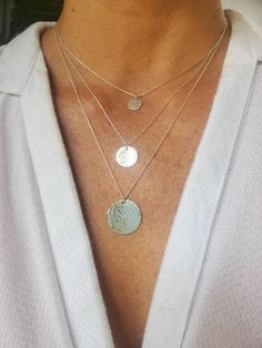 This small sterling silver necklace is perfect for layering! The 12mm solid sterling silver charm is hammered to give a fun effect, and shown here hanging from a 20 inch sterling silver chain, layered on bottom, with our tiny 9mm version in 17 inch length on top. We also have a larger 22mm size available as seen in the triple layer picture. Can also be made in gold fill as seen in the last photo. *Please note that this is for the 12mm disk necklace only. The other sizes are shown for comparison Sterling Silver Charm Necklaces For Layering, Everyday Silver Coin Necklace In Sterling Silver, Everyday Sterling Silver Coin Necklace, Sterling Silver Round Charm Necklaces For Layering, Everyday Silver Sterling Silver Coin Necklace, Silver Charm Necklace With Coin Pendant For Layering, Silver Round Disc Coin Necklace For Everyday, Silver Coin Pendant Jewelry For Layering, Sterling Silver Coin Necklace With Round Disc For Everyday