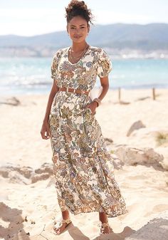 This paisley print maxi dress is such a statement piece. Chic Flowy Maxi Dress With Paisley Print, Chic Flowy Paisley Print Maxi Dress, Flowy Maxi Dress With Paisley Print, Flowy Paisley Print Maxi Dress, Spring Paisley Print Maxi Dress, Chic Paisley Print Maxi Dress For Vacation, Elegant Paisley Print Maxi Dress For Vacation, Wardrobe Building, Puff Sleeve Maxi Dress