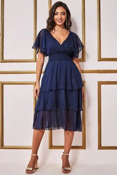 Layered dress in Navy for a very special occasion or visit our online store redcarpetdresses.co.uk or our physical store in Blackpool stocking 1000+ dresses Glamorous V-neck Dress For Wedding Guest, Navy V-neck Midi Dress For Evening, Formal Navy V-neck Midi Dress, V-neck Midi Dress For Evening Wedding, Summer Evening V-neck Mother Of The Bride Dress, Evening Wedding Midi Dress With V-neck, Navy Midi Length Evening Dress, Navy Knee-length Evening Dress, Elegant Summer Mother Of The Bride Dress For Party