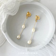 * Style: Minimalist, Classy, Elegant * Material: Gold-plated brass, Freshwater Pearls (natural pearl, each is unique) * Dimension:  Approximate overall length: 5.5 cm ( 2.17 inch)  * Please note that the size and shape of the pearls vary from pair to pair. *  * ❀ *  * ♥ ♥ How to wear coil pad clip-on earrings?  All you have to do is slip the clip-on onto your earlobe, press the coil pad and it will stay. ❗️❗️For wearing tips, please go to the "About" section, we've filmed a video for how to wear Gold Minimalist Bridal Earrings, Minimalist Bridal Earrings For Wedding, Minimalist White Teardrop Earrings For Wedding, Minimalist Pearl White Wedding Earrings, Minimalist Pearl Drop Teardrop Earrings For Wedding, Gold Minimalist Drop Pearl Earrings, Minimalist Gold Bridal Drop Earrings, Minimalist Teardrop Pearl Earrings For Wedding, Elegant Metal Teardrop Earrings For Wedding