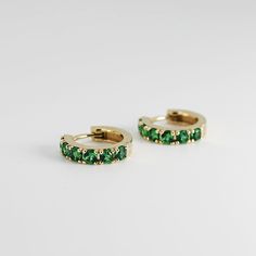 "14k emerald hoop earrings are made of 14k yellow gold. Material; 14k solid gold hoops Earrings measure , inner diameter is 10mm outer diameter is 13.45mm Round Emeralds: 12 pieces (for the pair) Emerald size : 2.5mm Emeralds are lab grown It is a great birthday gift for your special ones whose birthday are in May, since Emerald is May birthstone. This solid gold ring makes a perfect present for your anniversaries. Emerald is especially 20th and 50th anniversary stone. As the stone of the heart, Green Huggie Hoop Earrings For Anniversary, Green Small Hoop Huggie Earrings For Anniversary, Yellow Gold Hoop Earrings For May Birthstone, Classic Green Hoop Earrings For Anniversary, Hoop Earrings In Yellow Gold For May Birthstone, Fine Jewelry Hoop Earrings With May Birthstone, Green Emerald Hoop Earrings For Anniversary, Emerald Hoop Earrings As A Gift, Green Tarnish Resistant Huggie Earrings For Gifts