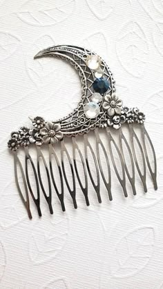 Crystal Moon Haircomb  * Moonstone Vibes This Crescent Moon Crystal Moon hair comb is decorated with flower embellishments and true swarovski Crystals. This haircomb has a very aesthetic look and feel. All in all this haircomb is a magical piece with a great moon design.  ☻Color: ~ Silver ☻Link to More Hair Accessories: https://www.etsy.com/shop/FashionCrashJewelry?ref=profile_header&search_query=hair+accessories ☻Link to The ENTIRE SHOP: https://www.etsy.com/shop/FashionCrashJewelry?ref=shopsec Crescent Moon Hair Clip, Crescent Moon Accessories, Celestial Hair Comb, Moon Hair Piece, Celestial Hair Accessories, Moon Hair Accessories, Hair Accessories Aesthetic, Mystical Wedding, Moon Hair Clip