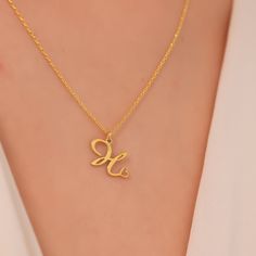 The Handmade Letter Necklace gold, which we offer in 925 Sterling Silver or 14 Karat Gold, is the perfect gift for Mothers Day. The 14K solid version of the letter necklace gift also comes with a 14K solid gold chain. This handmade tiny letter necklace is Silver or gold and perfect Made with quality.  PRODUCT HIGHLIGHTS  Made of high quality 925 Sterling Silver or 14K Solid Gold Necklaces for Women. You can personalize this silver necklace with your or your loved ones' names. For further customization requests, please contact us using Etsy messages. Available in Silver, Gold and Rose Gold Colors for the Silver version. Available in White Gold, Yellow Gold and Rose Gold for the 14K Solid Gold Edition.  HOW TO ORDER  Please select your necklace material and color from the drop-down list. Sel Gold Initials Name Necklace For Mom, Gold Initials Name Necklace As Gift For Mom, Gold Plated Initials Name Necklace For Anniversary, Gold Initial Necklace For Anniversary Gift, Gold Initial Necklace For Mother's Day, Yellow Gold Initials Necklace Gift For Mom, Valentine's Day 14k Gold Name Necklace With Hallmark, Engraved Initial Necklace For Mother's Day Anniversary, Engraved Initial Necklace For Anniversary On Mother's Day