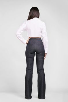 the back view of a woman in high rise jeans