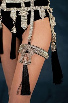 Amaya Garter Band is constructed with stainless steel beads and detailed with hand cut mirror clusters. The band is fully lined by hand in luxurious velvet and is adjustable at back to comfortably fit to your thigh circumference. This garter band can be worn with or without the removable tassel. Adjustable logo slider at back is made of stainless steel and is 100% hypoallergenic. CUSTOM: * For custom sizes, please contact us directly. We love to accommodate all shapes and forms. ULTIMATE QUALITY Gold Garter, Velvet Bra, Nickel Allergy, Stainless Steel Plate, Shape And Form, Bra Straps, Miu Miu Ballet Flats, Garters, Stage Outfits