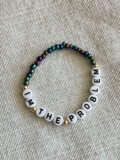 a beaded bracelet with words written on it