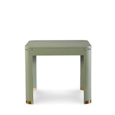 a small green table with gold legs