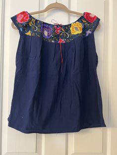 This Beautiful Off the Shoulder Blouse  is the perfect for a fun day out or stay home.  It's made out of cotton manta has an elastic waist and is full of vibrant embroidered florals.  This blouse comes in size S -L   All the blouse are final sale  Unique Colors and embroidery as showed in the pictures. Spring Cotton Off-shoulder Top With Ruffles, Cotton Off-shoulder Top With Ruffles, Casual Floral Embroidered Blouse For Vacation, Casual Embroidered Top With Boho Collar For Spring, Bohemian Off-shoulder Blouse With Ruffles, Peasant Style Cotton Top With Relaxed Fit, Casual Cotton Peasant Top For Vacation, Bohemian Cotton Tops For A Day Out, Spring Beach Peasant Style Embroidered Top