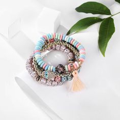 Embrace the bohemian charm and the ancient symbolism of the hamasa with this versatile and meaningful bracelet stack. This bracelet set includes four individual pieces, allowing you to mix and match or wear them together for a stacked and layered look. Our bracelets are designed with a boho-inspired aesthetic, incorporating a mix of vibrant colors, patterns, and textures. The eclectic combination adds a free-spirited and laid-back vibe to your overall look, making them perfect for bohemian enthusiasts. Bohemian Stacked Beaded Bracelets With Round Beads, Bohemian Stacked Round Beaded Bracelets, Bohemian Stacked Beaded Bracelets, Stacked Bohemian Beaded Bracelets, Bohemian Multicolor Stacked Beaded Bracelets, Multicolor Bohemian Charm Bracelet For Friendship, Bohemian Multicolor Charm Bracelet For Friendship, Bohemian Stacked Multicolor Jewelry, Bohemian Stackable Bracelets For Festival