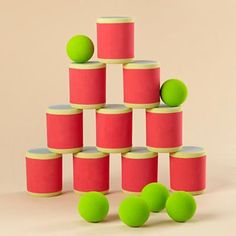 several green balls are placed on top of each other in the shape of a pyramid