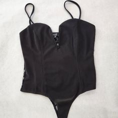 New-Privy Black Bodysuit Color: Black Size: M #Sexystyle #Blackbodysuit #Bodysuitbabe #Dresstoimpress #Boldandbeautiful #Partywear High Cut Club Bodysuit With Lined Body, Club High Cut Lined Bodysuit, Club-ready High-cut Lined Bodysuit, Low-cut Bodysuit With Built-in Bra For Night Out, Black Low-cut Bodysuit, Black Bodysuit With Built-in Bra For Club, Shapewear Bodysuit With Lined Body For Night Out, Black Low-cut Bodysuit With Lined Body, Black Underwire Bodysuit With Lined Body