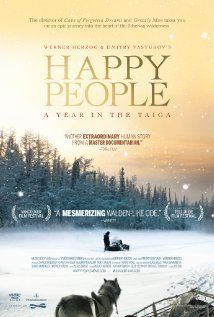 a movie poster for happy people with two dogs in the snow and one man on a boat