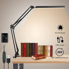 an image of a desk lamp with books on it