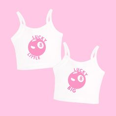 two women's tank tops with the words lucky little and 8 on them against a pink background