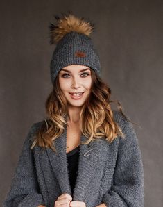 All our knitted hats are with 100% cotton lining so it's perfect for chilly spring weather. Wind resistant and the head is not sweating. Because of the lining hats don't stretch and keep its shape. Fur pom color can be a bit different because fur is natural and not colored. Material: 70% Merino wool, 30% alpaca wool Lining: 100% cotton Pom pom: Natural fur Colors available: Ivory, Black, White, Dark grey, Light grey, Dark blue, Red Sizes available: S 22 inches , 56/58 cm , M 23 inches, 58/60 cm Weather Wind, Wool Knitted Dress, Wool Berets, Hat Handmade, Spring Weather, Grey Knit Sweater, Wool Turtleneck, Knit Turtleneck Sweater, Slouchy Hat