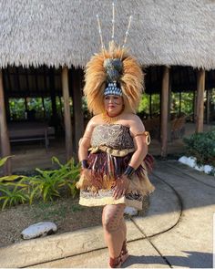 a woman in an elaborate dress and headdress