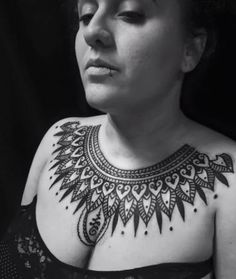 a woman with a tattoo on her chest