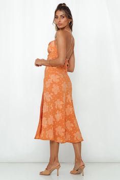 Length from bust to hem of size S: 115cm. Orange midi dress. Lined. Cold hand wash only. Model is a standard XS and is wearing size XS. True to size. Lightweight, non-stretchy woven burnout satin fabric. Adjustable lace-up back. Invisible back zipper. Floral pattern may vary. Polyester. Our Drinks On Me Midi Dress screams vibes whenever you wear it! Exuding elegance from dusk to dawn, this sophisticated gown features a stunning floral pattern throughout, a cowl neckline, and our favourite lace-u Spring Carnival, Orange Midi Dress, Dusk To Dawn, Dress Orange, Slip Skirt, Print Dresses, Hey Girl, Midi Dresses, Satin Fabric