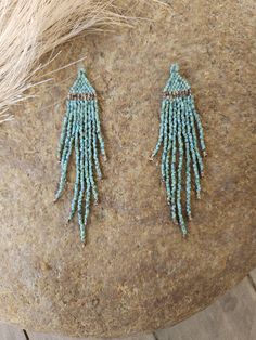 Fall Fringe - Turquoise Gorgeous turquoise fringe with speckled brown accent. This is a beautiful, simple and easy to wear pair. Lightweight and made with the highest-quality materials. These very lightweight, and are made with the highest quality glass beads, more resistant to breaking. These beautiful earrings should last a lifetime and make for a beautiful, one of a kind gift for yourself or a loved one. Easy to wear, day or night! ⸙ Length: 3 inches  ⸙ Beads: The highest quality of glass bea Light Blue Beaded Dangle Jewelry, Turquoise Dangling Bead Drop Earrings, Turquoise Dangling Beaded Earrings, Turquoise Beaded Earrings For Gifts, Turquoise Dangle Jewelry With Tiny Beads, Turquoise Beaded Drop Earrings With Spacer Beads, Turquoise Drop Beaded Earrings, Adjustable Turquoise Earrings With Spacer Beads, Turquoise Dangle Beaded Earrings With Tiny Beads