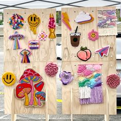 two wooden boards with different designs on them and one has an umbrella in the background