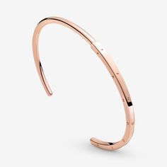 Streamline your look with the Pandora Signature I-D Bangle. With a half-squared, half-rounded profile, this 14k rose gold-plated bangle is hand-finished. The round polished profile transitions to a larger squared profile in the middle, which features the Pandora logo on its three outer sides. Each end of the bangle includes the Pandora Crown O monogram. The bangle is precisely sized for optimal performance and fit and is not designed to be flexed and twisted when put on and removed. - Pandora Si Pandora Open Bangle, O Monogram, Pandora Logo, Pandora Rose Gold, Open Bangle Bracelet, Pandora Rose, Bracelet Pandora, Rose Gold Bangle, Sterling Silver Charm Bracelet