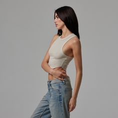 Not your average tank. Introducing the Scallop Tank. Cut from ultra-lightweight modal rib for the most comfortable fit and feel yet. Featuring a curved hem and racer back, this is the tank you're missing. 96% Modal, 4% Spandex Form Fitting Soft Ribbed Texture Crop Length Raw-Hem Scallop Hemline Racerback Shape Summer Racerback Crop Top For Everyday, Everyday Summer Racerback Crop Top, Racerback Tank Top For Yoga In Spring, Spring Yoga Racerback Tank Top, High Stretch Seamless Tank Top For Everyday, Fitted Muscle Tee For Spring, Seamless Racerback Tops, Fitted Muscle Tee For Spring Athleisure, Fitted Muscle Tee For Everyday Spring Wear