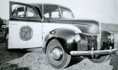 an old black and white photo of a truck