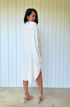 Relax in style with the Aura shirtdress, a unique take on traditional loungewear. Made from breathable double gauze cotton, it's perfect for casual wear out, at home, or even as a beach coverup. The button-down design adds a touch of style and versatility to your wardrobe, ensuring comfort and convenience as you go about your day. Oversized Spring Tunic For Loungewear, Spring Cotton Gauze Loungewear Dresses, Spring Cotton Gauze Dresses For Loungewear, Spring Cotton Tunic For Loungewear, Casual Cotton Gauze Long Sleeve Dress, Casual Long-sleeved Cotton Gauze Dress, Spring Relaxed Fit Shirt Dress For Loungewear, Casual Long Sleeve Cotton Gauze Dress, Summer Tunic With Shirttail Hem For Daywear