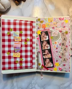 an open scrapbook with pictures and words on the pages, sitting on a table