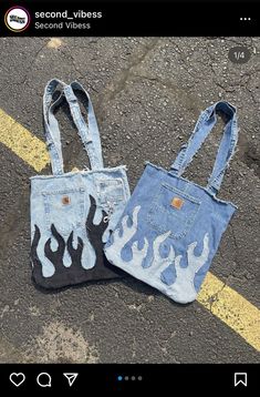 two denim bags with flames painted on them