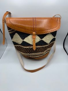 Sisal Kenyan bags that are lined inside and are adjustable. They come in many beautiful colors and designs. Woven Straw Pouch Bag For Shopping, Handwoven Brown Leather Bucket Bag, Handwoven Leather Crochet Tote Bag, Handwoven Leather Tote Crochet Bag, Everyday Use Woven Leather Pouch Straw Bag, Brown Leather Handwoven Bucket Bag, Handwoven Leather Bucket Bag In Natural Color, Brown Jute Crochet Bag With Woven Leather, Artisan Woven Bucket Bag