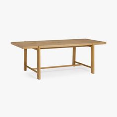 a wooden table on a white background with no one around the table to see it