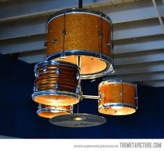 a drum set hanging from the ceiling in a room